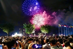 People celebrate New Year's Eve in Ho Chi Minh City, Vietnam. (Photo: VNA)