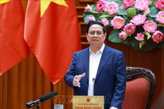 Prime Minister Pham Minh Chinh speaks at the meeting of permanent Government members in Hanoi on December 23. (Photo: VNA)