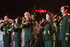 A performance at the opening ceremony of the exhibition celebrating 80 years of culture and arts of the Vietnam People's Army (VPA) in the pedestrian space around Hoan Kiem Lake in Hanoi. (Photo: VNA)