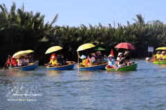 Beyond the bustling streets of Hoi An, the waterways of Cam Thanh Nipa Palm Village offer a slower rhythm of life, where basket boats glide beneath dense green palms and the sounds of river culture still echo through the breeze. (Photo: VNA)