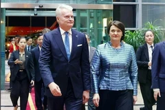 Lithuanian President Gitanas Nauseda and his spouse, Diana Nausediene, arrive in Hanoi on June 11, beginning an official visit to Vietnam. (Photo: VNA) 