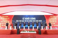 Party General Secretary To Lam (centre) and officials press the button to launch the construction of the Ho Chi Minh Temple and Van Mieu park in Bac Ninh city.