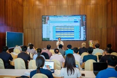 The two-week programme gathers nearly 40 scientists, young researchers, PhD students, engineers, technicians, and students from five countries. (Photo: VNA)