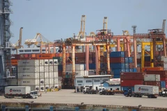 A truck arrives as another departs from Laem Chabang deep-sea port in Chon Buri province. Thai exports to the US could face higher trade barriers. (Photo: Bangkok Post)