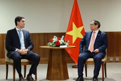 Prime Minister Pham Minh Chinh meets a representative of Vale, a multinational group specialising in metals, mining, and logistics, in Brazil's Rio de Janeiro city on July 7 (local time). (Photo: VNA)