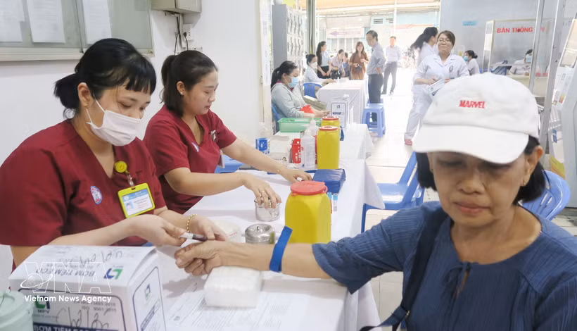 Residents receive health check-ups at Cho Lon Ward Health Station. (Photo: VNA) 