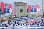 President Luong Cuong delivers a keynote policy address at the plenary session of the Angolan National Assembly on August 7. (Photo: VNA)