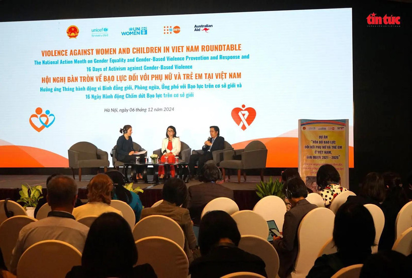 Experts at the roundtable in Hanoi to discuss violence against women and children. (Photo: VNA)
