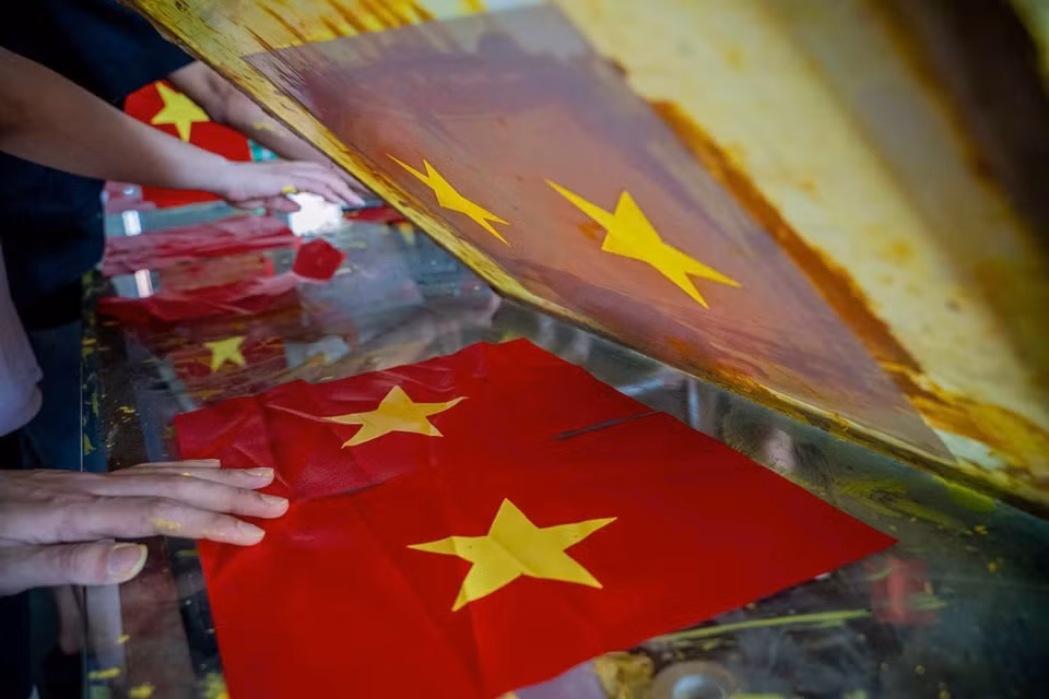 Every stage and every flag is completed with meticulous attention to detail by villagers. (Photo: VNA)