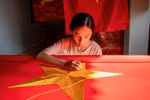 Flag-making village awash in red ahead of National Day