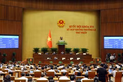 National Assembly deputies vote and pass the Law amending and supplementing a number of articles of the Law on State Compensation Liability. (Photo: VNA)