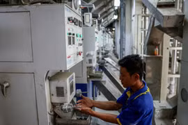 A man works at a rice mill in Nakhon Pathom province, Thailand, on April 18, 2025. (Photo: Bangkok Post) 