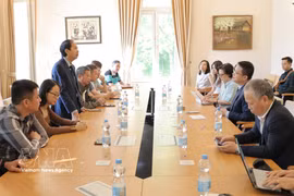 Assoc. Prof. Dr. Nguyen Van Tung, a member of the Members' Council of the Vietnam Education Publishing House, speaks at a meeting with the Vietnamese Embassy. (Photo: VNA)