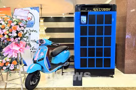 Selex's electric motorcycles and battery-swapping station model (Photo: VNA) 