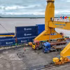 Loading and unloading containers at Cai Cui Port in Can Tho city. (Photo: VNA)