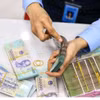 The daily reference exchange rate is set at 25,638 VND/USD on October 7. (Photo: VNA)