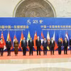 Standing Deputy Prime Minister Pham Gia Tuc (fifth from left) and heads of ASEAN and Chinese delegations (Photo: VNA)