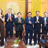Delegates pose for a group photo at the working session (Photo: VNA)