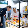 A visitor enjoys sampling Vietnamese soft-dried fruit. (Photo: VNA)