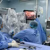 Binh Dan Hospital doctors perform a robotic surgery. (Photo: VNA) 