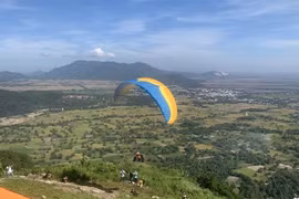 A paraglider takes off on Phung Hoang Mountain in An Giang province’s Tri Ton district. (Photo: VNA)