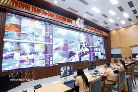 Police officers monitor traffic around the clock through an AI-powered camera system at the Traffic Police Department’s Command and Information Centre under the Ministry of Public Security. (Photo: VNA)