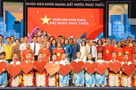 Vice Chairwoman of the National Assembly Nguyen Thi Thanh, Minister of Health Dao Hong Lan, and delegates attend the programme. (Photo: nhandan.vn)