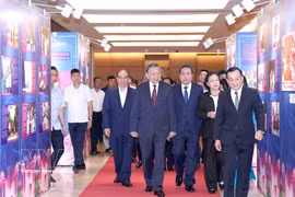General Secretary of the Communist Party of Vietnam Central Committee and President To Lam, and other Party and State leaders visit an exhibition themed “Simple yet noble examples” on September 3. (Photo: VNA)