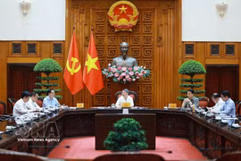 Prime Minister Le Minh Hung chairs a meeting on the national digital architecture framework in Hanoi on July 3. (Photo: VNA)