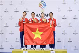 Athletes Hoang Thi My Tam, Dinh Thi Huong, Nguyen Thi Dieu Ly and Nguyen Thi Thu deliver an outstanding performance at SEA Games 33, defeating hosts Thailand 2-0 to clinch the gold medal on December 14. (Photo: VNA)