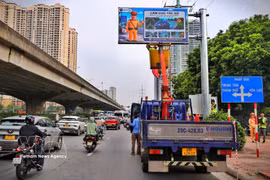 A variable massage sign is examined before it is put into operation. (Photo: VNA)