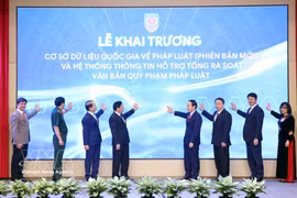 Officials launch the updated National Database on Legal Documents on April 23. (Photo: VNA)