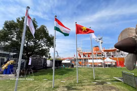The national flag of Vietnam flies alongside the flags of other countries at the 2026 Asian Games. (Photo: VNA)