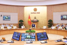 Prime Minister Pham Minh Chinh chairing the Government's meeting on October 5 (Photo: VNA)