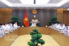 At the meeting to discuss the restructuring and reorganisation of the fuel distribution system (Photo: VNA)
