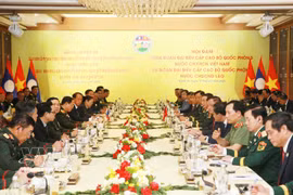 The high-level delegations from the Ministries of Defence of Vietnam and Laos hold talks in the central province of Nghe An on July 10. (Photo: VNA)