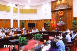 Prime Minister Pham Minh Chinh chairs meeting between standing Cabinet members and ministries, sectors, and agencies regarding decentralisation, delegation of authority, and delineation of powers associated with the implementation of the two-level local administration model. (Photo: VNA)