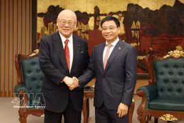 Deputy Prime Minister Nguyen Van Thang (right) receives Special Advisor to the Japan-Vietnam Parliamentary Friendship Alliance Takebe Tsutomu in Hanoi on October 12, 2026. (Photo: VNA)