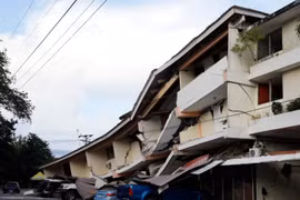 A building collapses and vehicles are damaged following an earthquake in Penonomé, Coclé province, central Panama, on October 9. (Photo: Xinhua)
