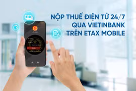 Customers holding accounts/cards at VietinBank can pay taxes electronically via the eTax Mobile application of the Department of Taxation. (Photo: VietnamPlus) 