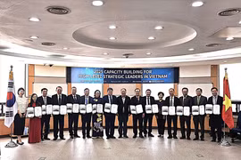 The Vietnamese delegation at the closing ceremony of the training course. (Photo: VNA) 
