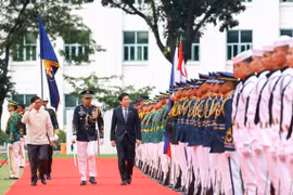 PM Lawrence Wong (centre) and Philippine President Ferdinand Marcos Jr (far left) reviewing an honour guard at Malacanang Palace in Manila on June 4. (Photo: MDDI) 