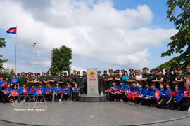 Young military officers from Vietnam, Laos and Cambodia visit the tri-border marker in Quang Ngai province on May 28. (Photo: VNA)