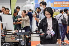 Visitors explore agricultural production equipment on display at Agri & Biotech Vietnam 2026 in Ho Chi Minh City. (Photo: VNA)