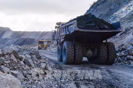 Trucks carry coal mined in Quang Ninh province. (Photo: VNA)