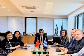Vietnamese Ambassador Pham Thi Thu Huong meets with Greek Minister for Migration and Asylum Athanasios Plevris during a working session. (Photo: Published by VNA)