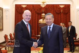 General Secretary of the Communist Party of Vietnam (CPV) Central Committee and President To Lam (right) receives FIFA President Gianni Infantino in Hanoi on August 26 (Photo: VNA)
