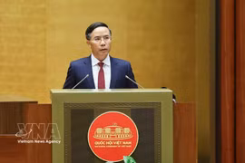 SBV Governor Pham Duc An presents a proposal on a draft law amending and supplementing a number of articles of the Law on the State Bank of Vietnam, the Law on Anti-Money Laundering, and the Law on Credit Institutions at the 16th National Assembly’s first extraordinary session on August 5 (Photo: VNA)