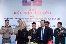 At the signing ceremony (Photo: VNA)