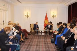Party General Secretary To Lam (right) receives AAFV Chairman Nguyen Hai Nam during his visit to France in 2024. (Photo: VNA)
